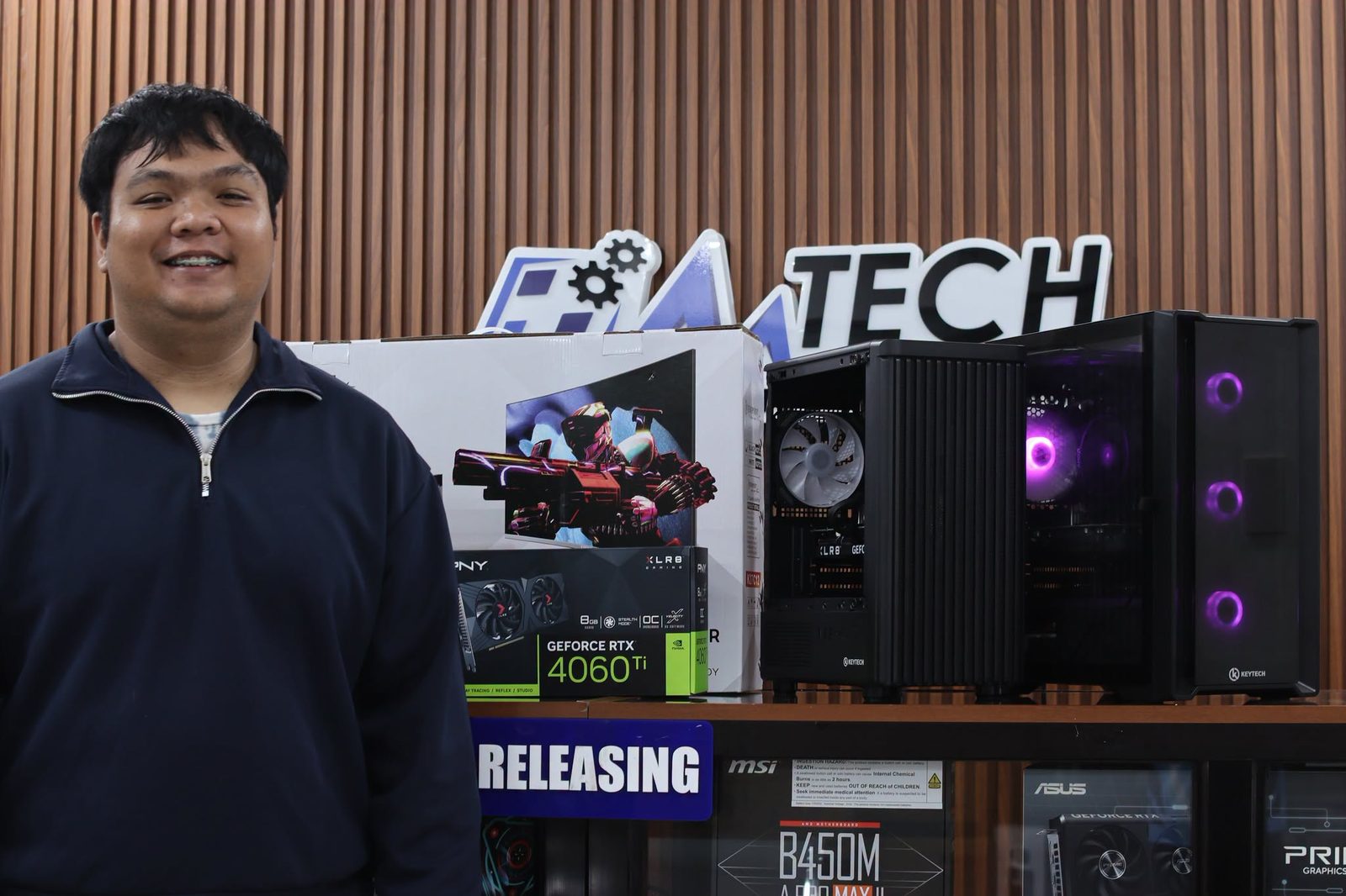 M-Tech customer receiving his new custom PC at the Bustos branch