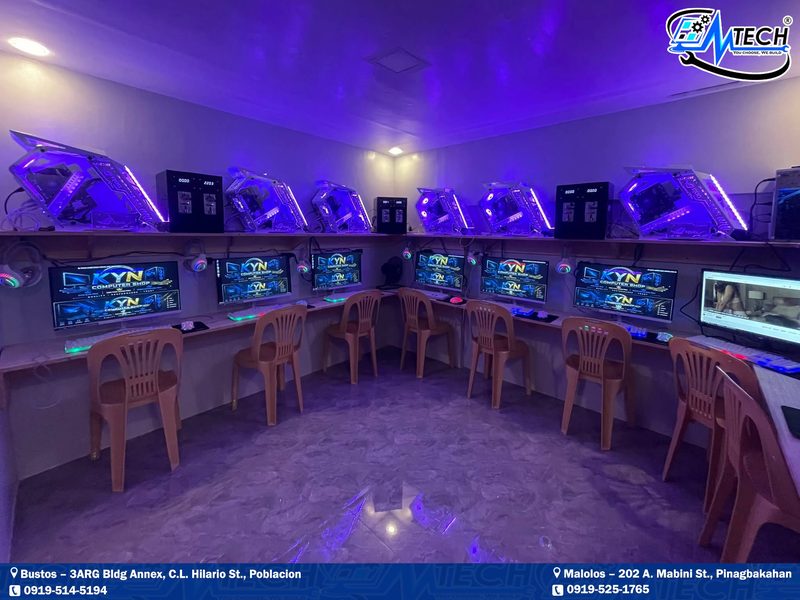 Purple-lit gaming café, fully set up by M-Tech